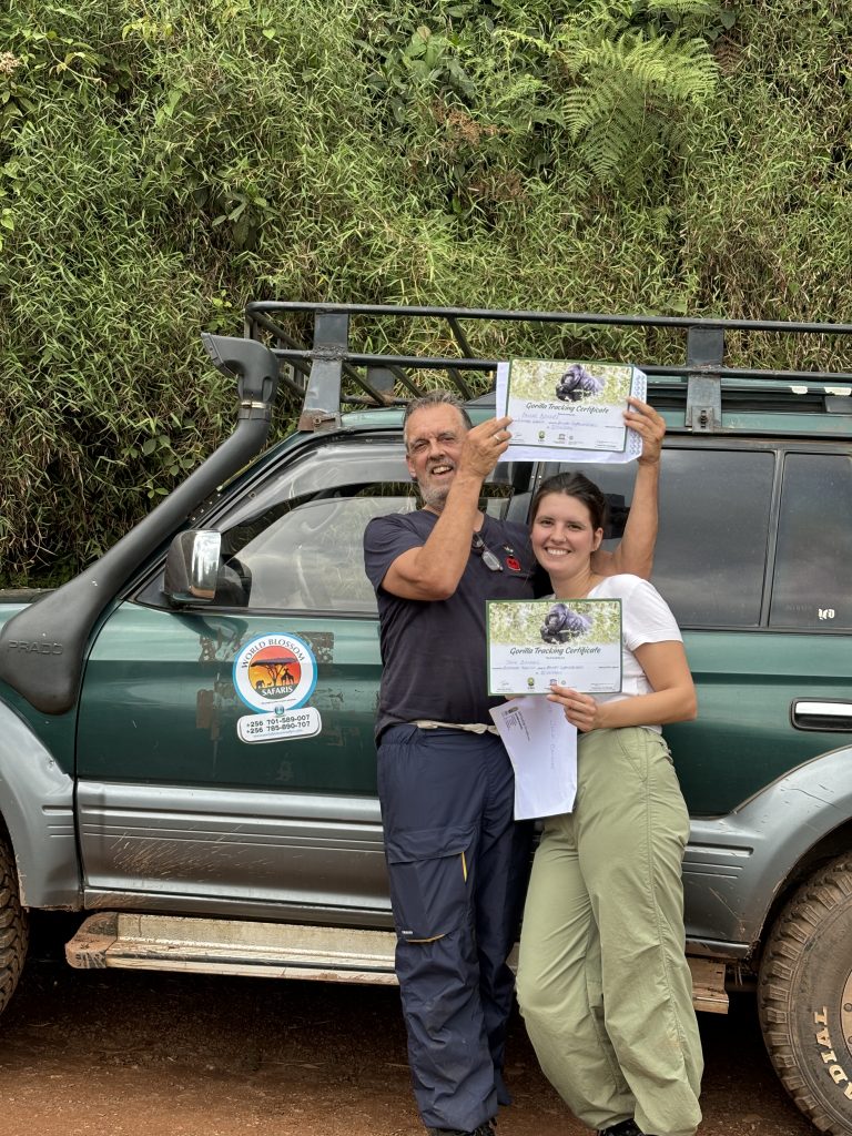 The Top 25 Best Things to Do in Uganda: clients getting their certificates after trekking gorillas